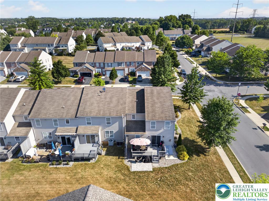 4148 Ross Road Bethlehem, PA 18020 - Photo 7 of 67 An aerial perspective reveals townhouses nestled in a verdant neighborhood with ample outdoor leisure spaces.
