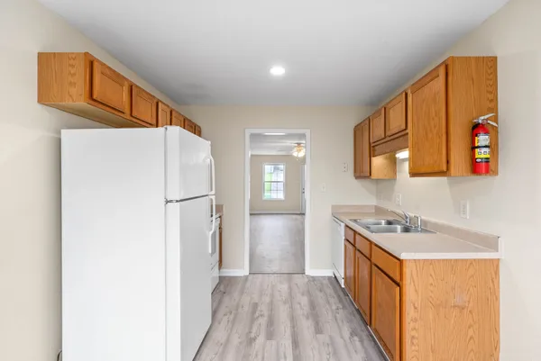 a hallway with washer and dryer