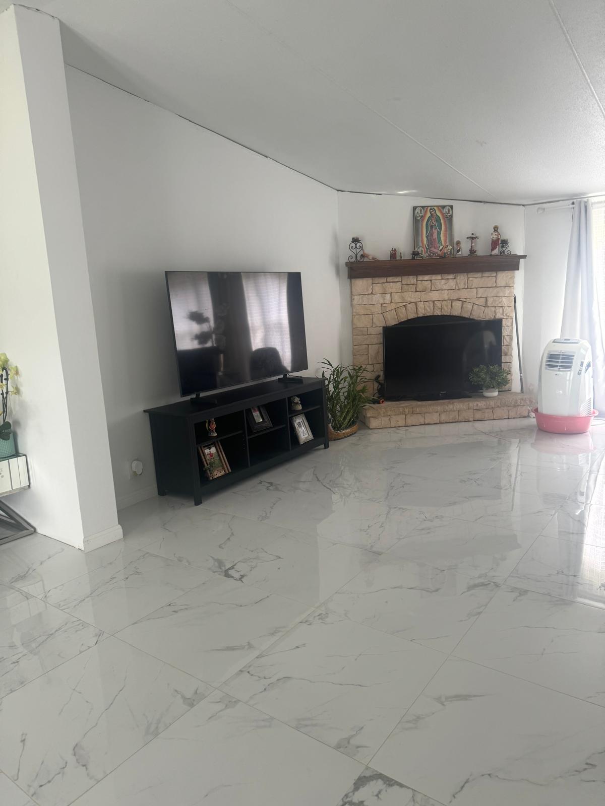 401 Ride Out Boulevard Elgin, TX 78621 - Photo 6 of 11 a living room with furniture and a fireplace