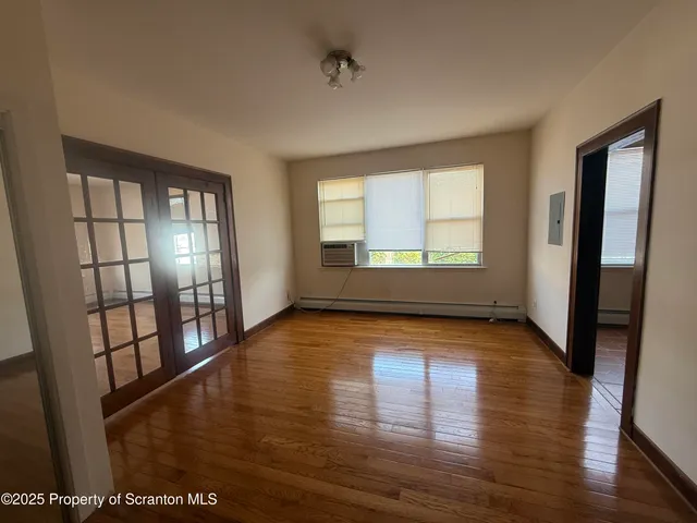 a kitchen with stainless steel appliances a refrigerator sink and microwave