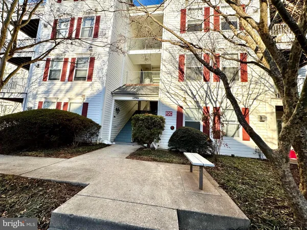 a view of a building with a yard