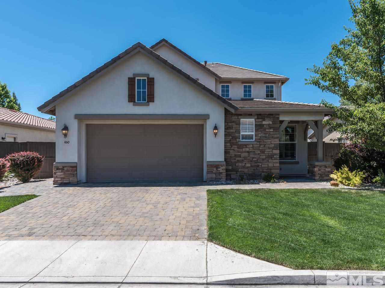 460 Miesque Court Reno, NV 89521 - Photo 1 of 25 a front view of a house with a yard and garage