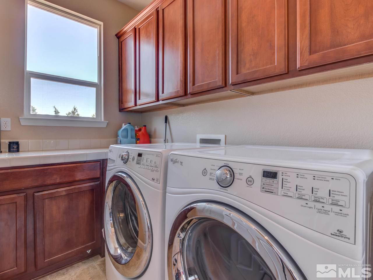 460 Miesque Court Reno, NV 89521 - Photo 22 of 25 a utility room with dryer and washer
