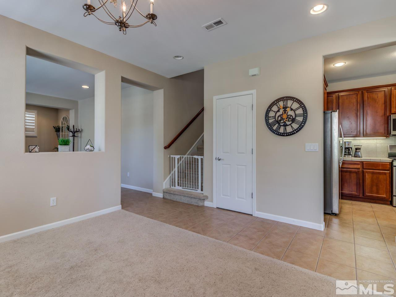 460 Miesque Court Reno, NV 89521 - Photo 4 of 25 a view of an empty room with a kitchen