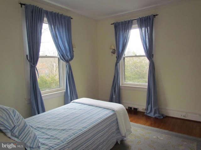 4815 Keswick Road Baltimore, MD 21210 - Photo 19 of 30 a bedroom with a bed and a window