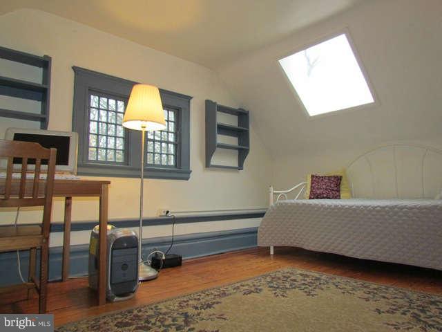 4815 Keswick Road Baltimore, MD 21210 - Photo 24 of 30 a living room with furniture window and wooden floor