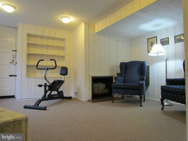 4815 Keswick Road Baltimore, MD 21210 - Photo 25 of 30 a view of a livingroom with furniture and a gym cycle