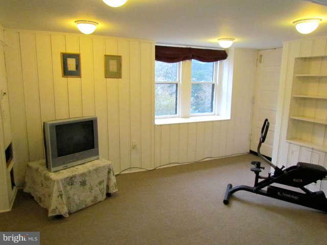 4815 Keswick Road Baltimore, MD 21210 - Photo 26 of 30 a view of a livingroom with workspace and a window