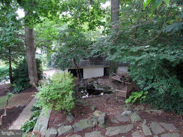 4815 Keswick Road Baltimore, MD 21210 - Photo 6 of 30 a view of a house with a yard and large trees