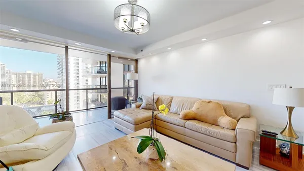 a living room with furniture and a flat screen tv