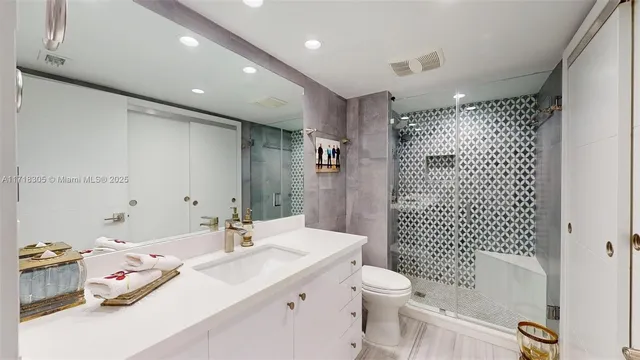 a bedroom with a bed and a night stand