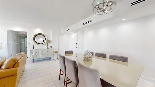 a kitchen that has a lot of cabinets a sink and appliances in it