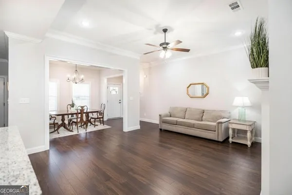 a kitchen with stainless steel appliances granite countertop a stove and a microwave