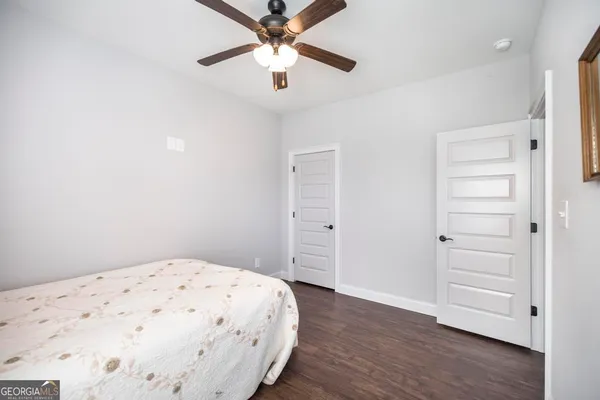 an empty room with window and wooden floor