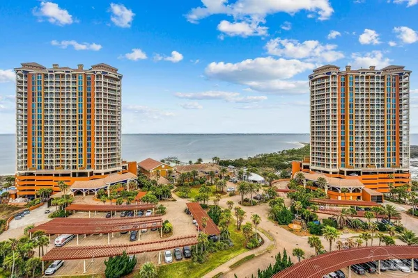 a view of ocean with a multi story building