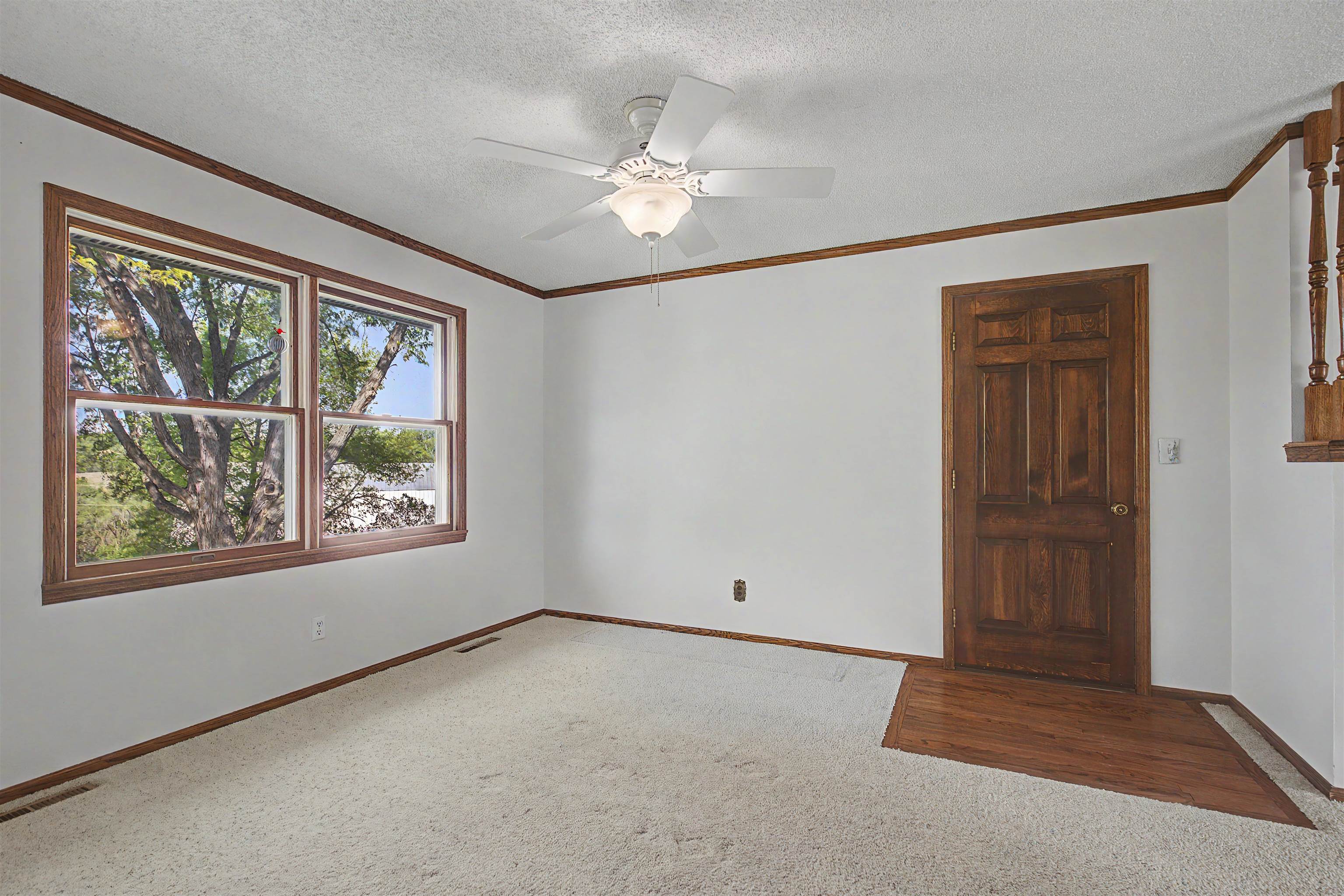 17380 Corbett Road Mount Carroll, IL 61053 - Photo 9 of 65 an empty room with windows and closet