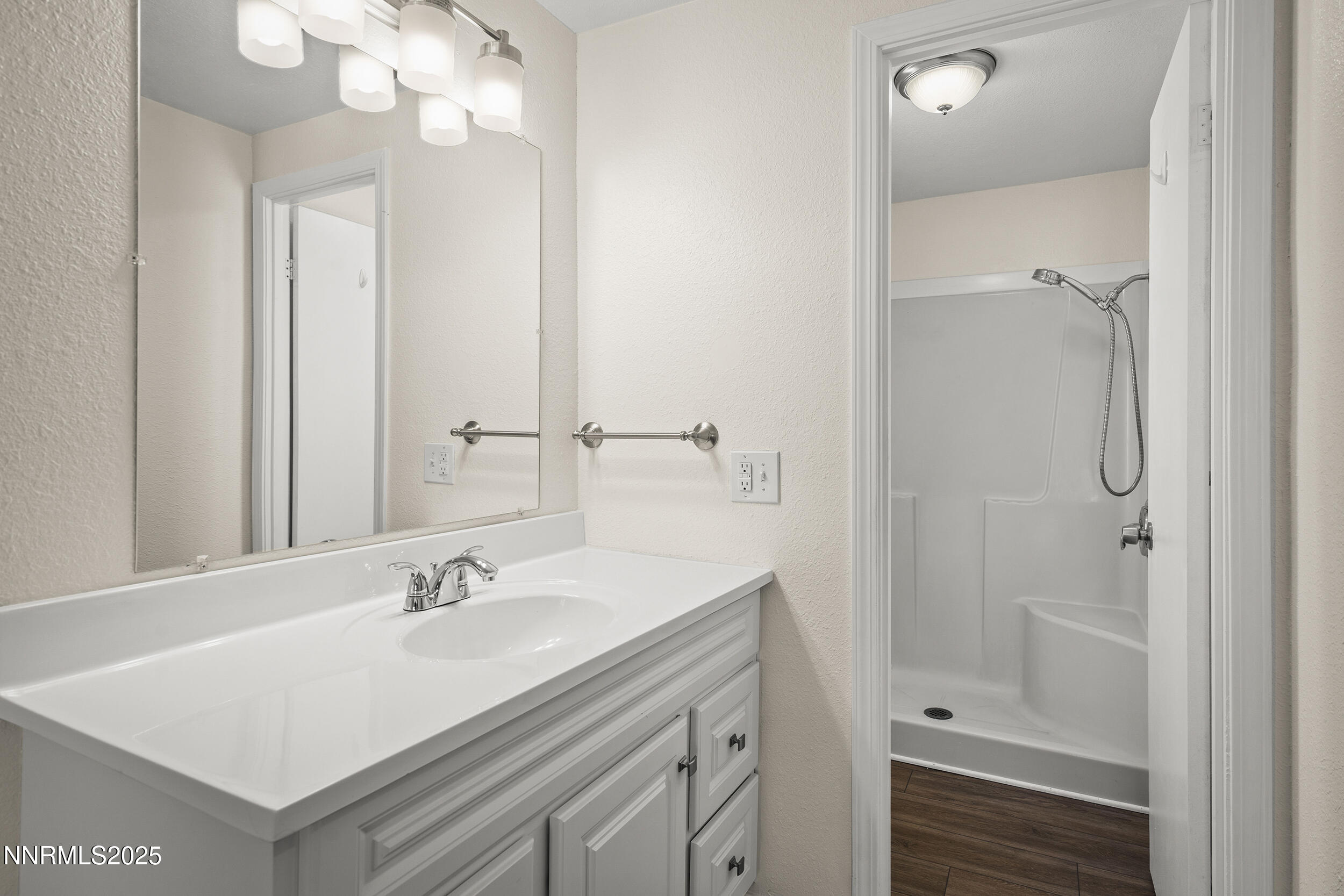 17855 Blackbird Drive Reno, NV 89508 - Photo 14 of 26 a bathroom with a sink vanity granite tub and shower