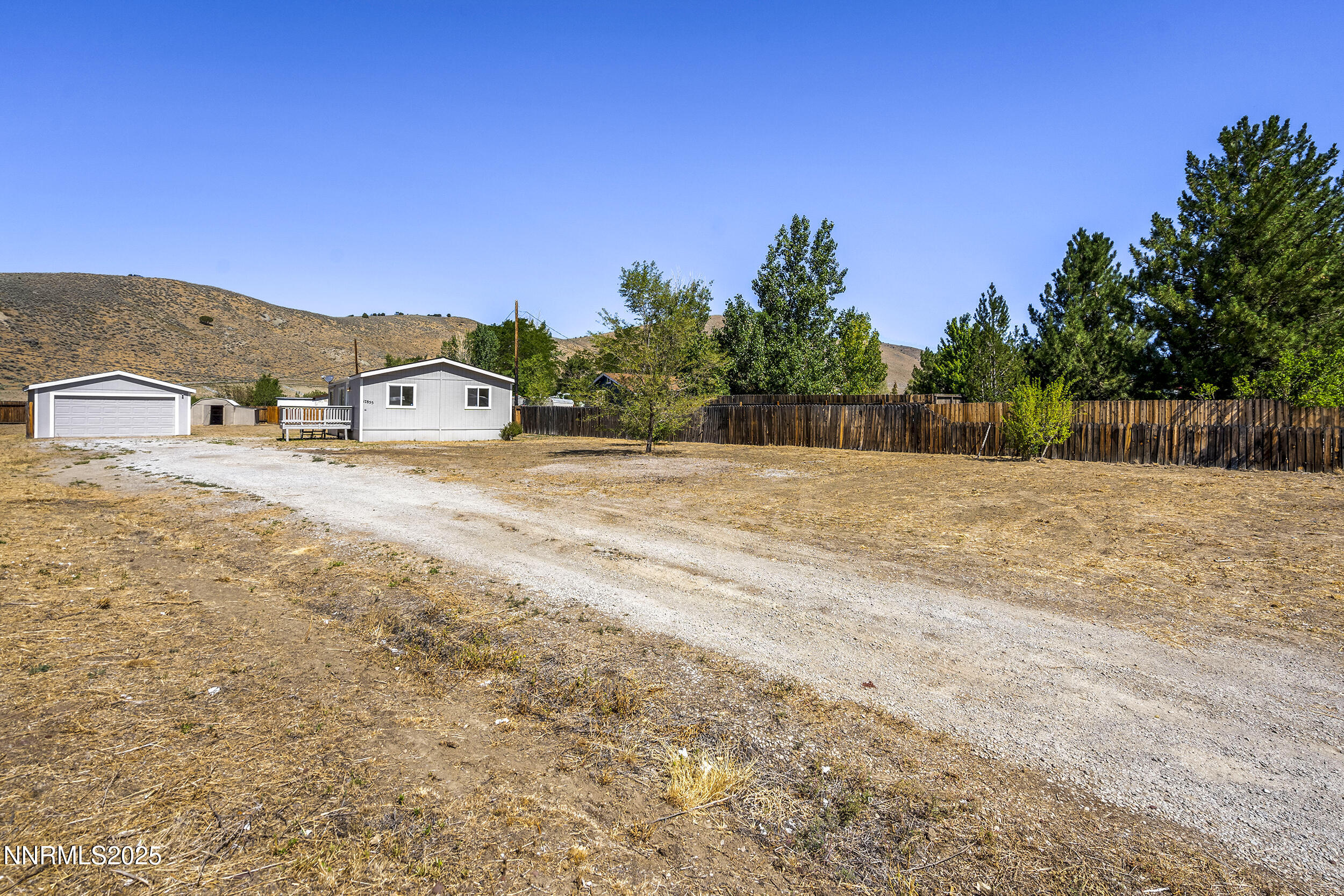 17855 Blackbird Drive Reno, NV 89508 - Photo 20 of 26 a view of dirt road with a building in the background