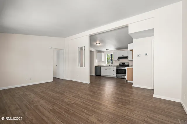 a view of kitchen with wooden floor
