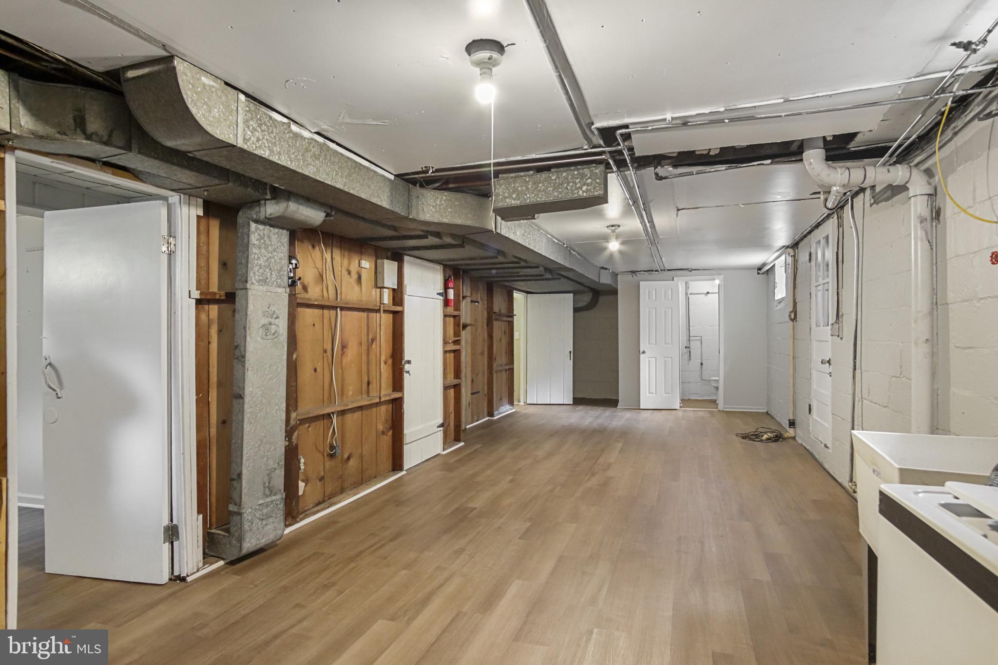 608 Farmhurst Road Baltimore, MD 21208 - Photo 42 of 45 a view of empty room with wooden walls