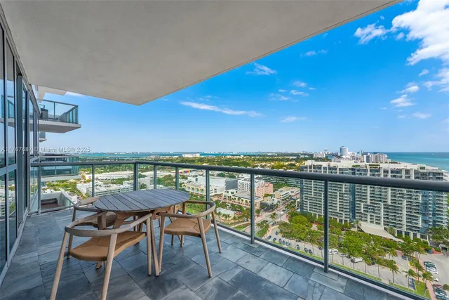 a view of a chairs and table on the terrace