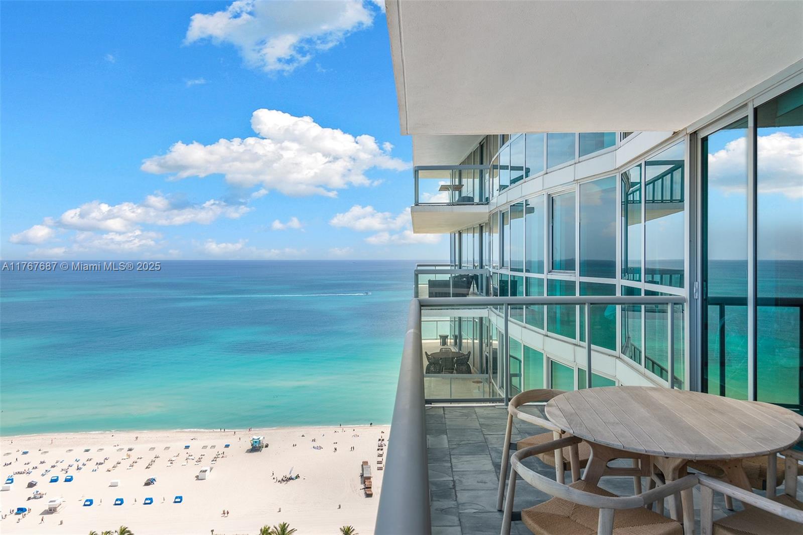 101 20th Street, Unit 3105 Miami Beach, FL 33139 - Photo 16 of 34 a view of a balcony with chair and table