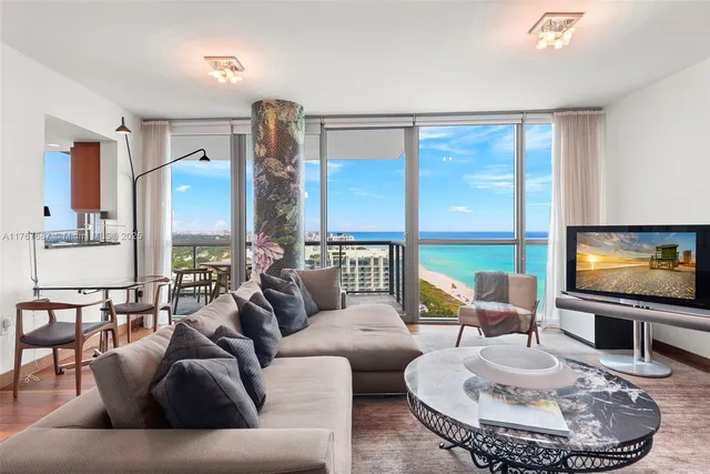a living room with furniture and a flat screen tv