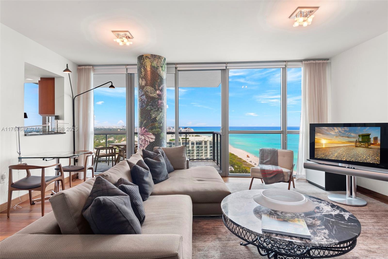 101 20th Street, Unit 3105 Miami Beach, FL 33139 - Photo 2 of 34 a living room with furniture and a flat screen tv