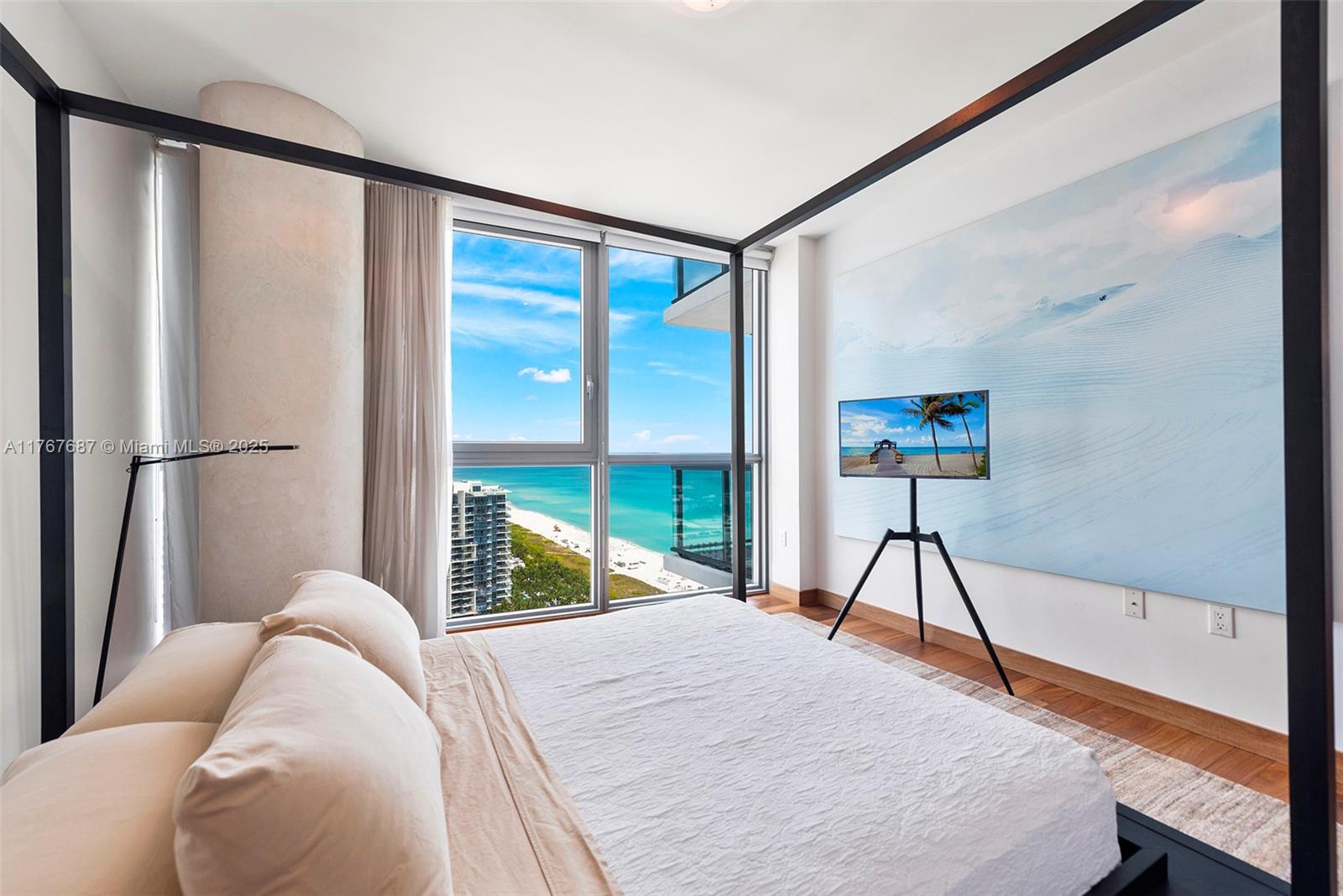 101 20th Street, Unit 3105 Miami Beach, FL 33139 - Photo 21 of 34 a bed sitting in a bedroom next to a window