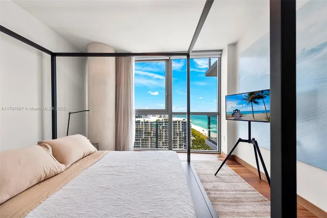 a bedroom with a bed and a table