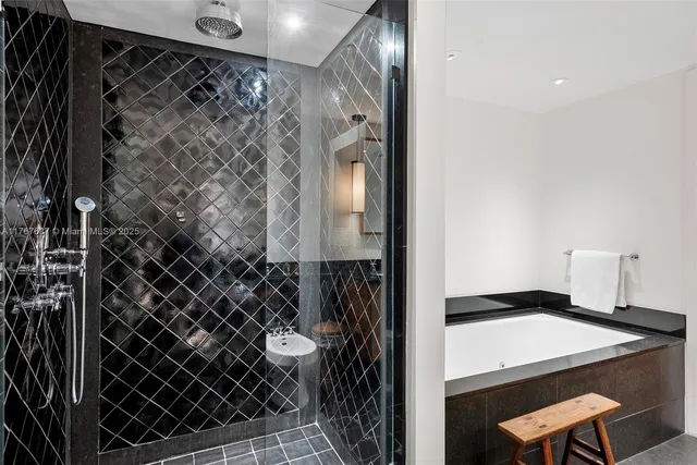 a bathroom with a granite countertop sink double vanity and a mirror