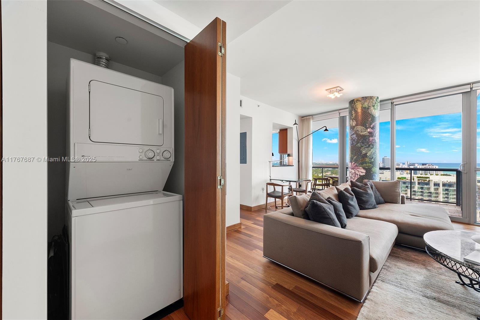 101 20th Street, Unit 3105 Miami Beach, FL 33139 - Photo 32 of 34 a living room with furniture and a large window