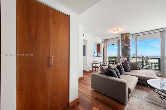 a kitchen with stainless steel appliances wooden cabinets and a table
