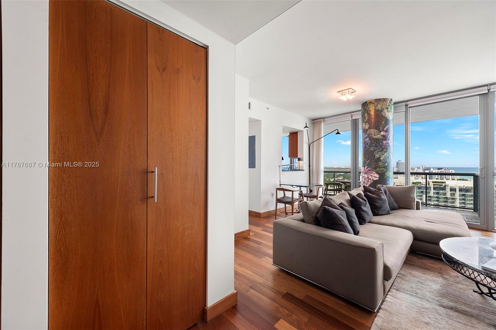 101 20th Street, Unit 3105 Miami Beach, FL 33139 - Photo 33 of 34 a living room with furniture and a large window