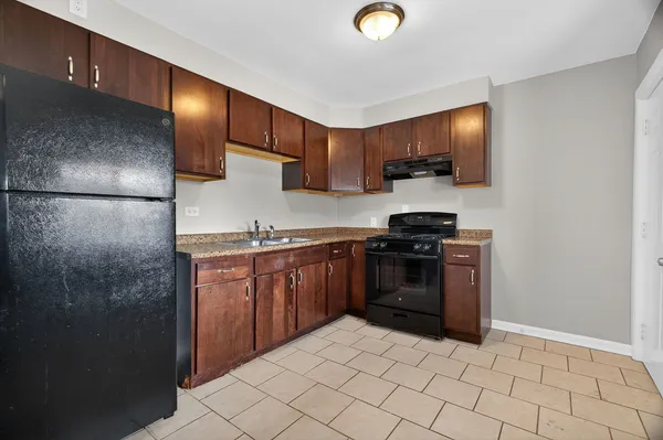 a kitchen with a stove and a microwave