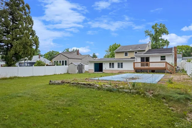 a front view of a house with a big yard