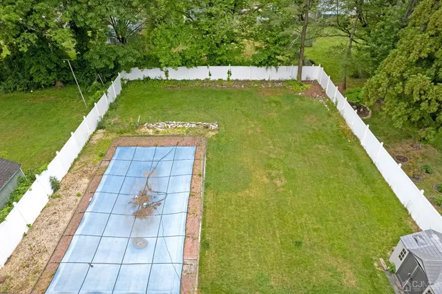 a view of a swimming pool with a patio