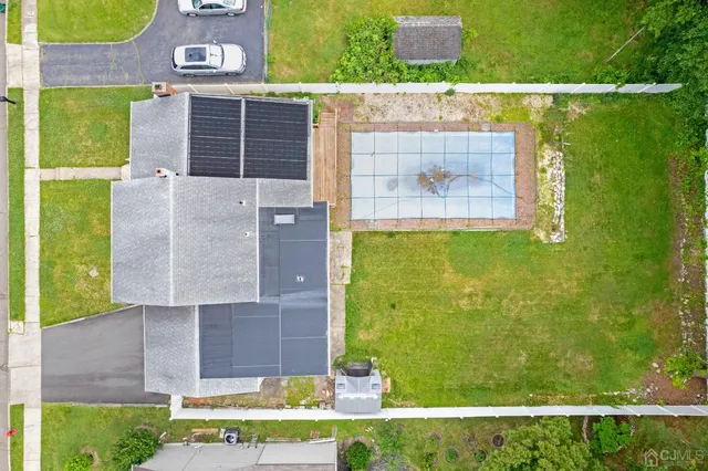 a aerial view of a house with a yard