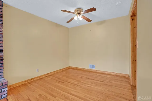 a view of a big room with wooden floor