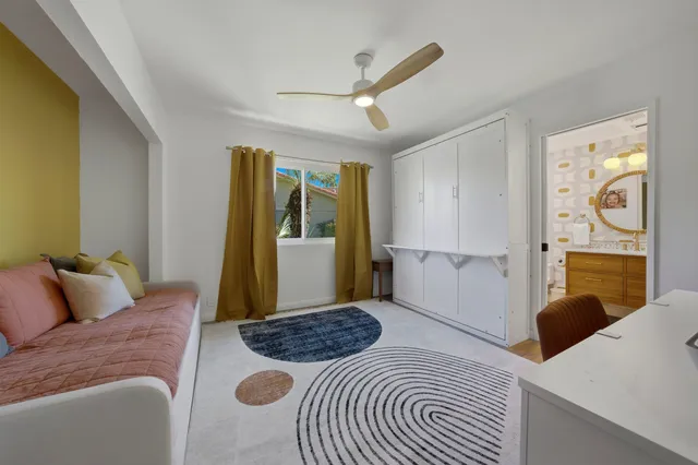 a bedroom with a bed and a couch