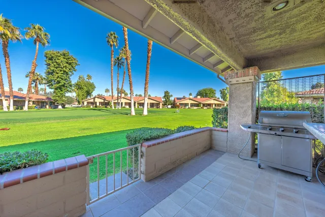 a view of a backyard with swimming pool