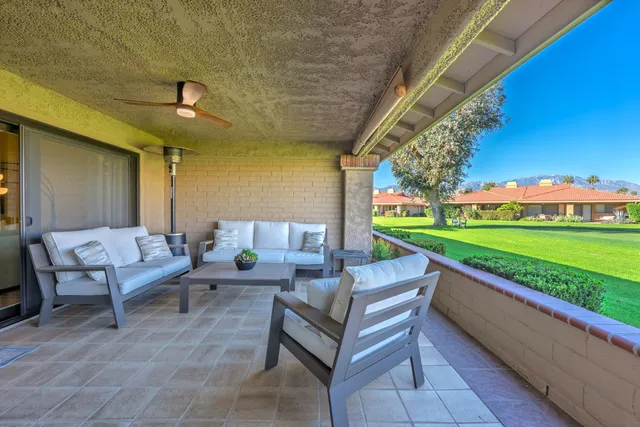 a outdoor living space with furniture and garden view
