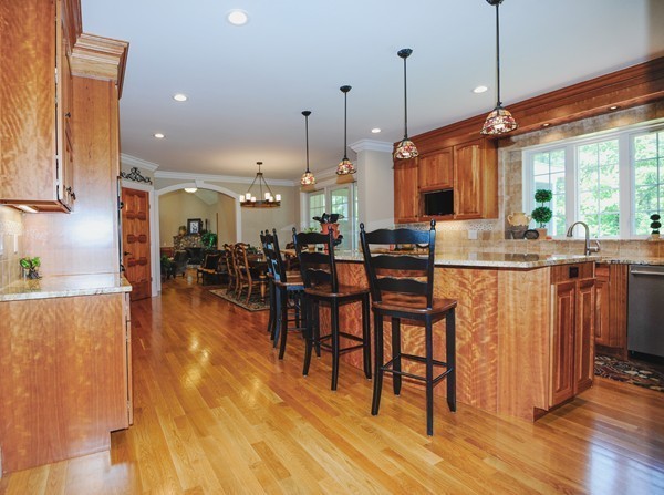 26 Cider Circle Bolton, MA 01740 - Photo 11 of 30 a group of people sitting in a kitchen