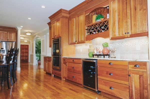 26 Cider Circle Bolton, MA 01740 - Photo 14 of 30 a kitchen with stainless steel appliances granite countertop a stove a sink and a refrigerator