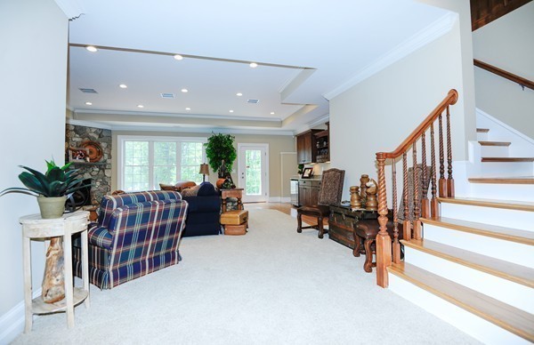 26 Cider Circle Bolton, MA 01740 - Photo 16 of 30 a living room with furniture gym equipment and a view of living room