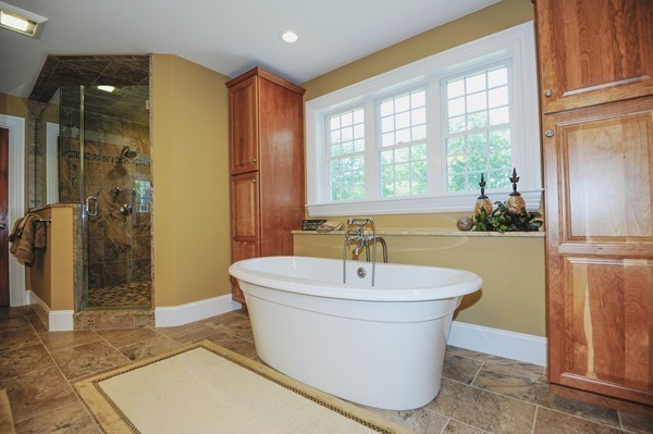 26 Cider Circle Bolton, MA 01740 - Photo 22 of 30 a white bath tub sitting in a bathroom