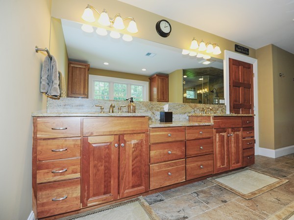 26 Cider Circle Bolton, MA 01740 - Photo 23 of 30 a kitchen with stainless steel appliances a cabinets and chandelier