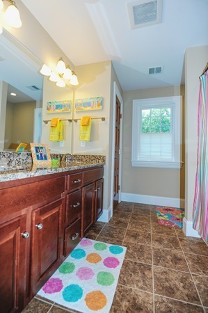 26 Cider Circle Bolton, MA 01740 - Photo 25 of 30 a room with a rug and a open kitchen view