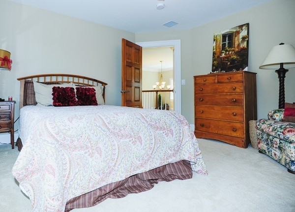 26 Cider Circle Bolton, MA 01740 - Photo 28 of 30 a bedroom with a bed and a cabinets