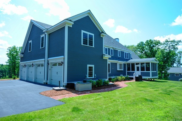 26 Cider Circle Bolton, MA 01740 - Photo 29 of 30 a view of a house with a yard and plants